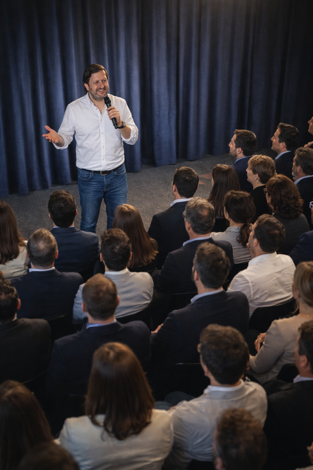 Gonzalo speaking to a packed audience